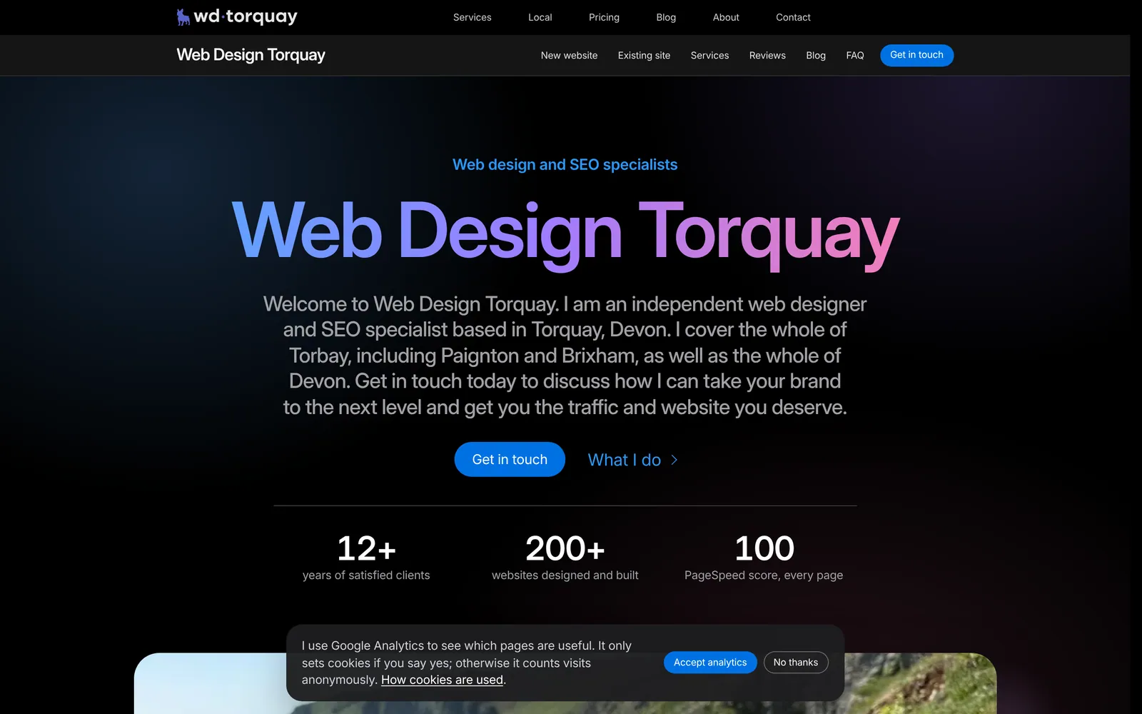 The Web Design Torquay home page on a laptop